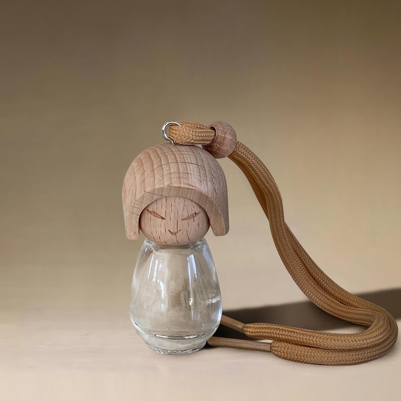 il_794xN.6708812521_nntm.jpg Kokeshi Wooden Car Diffuser - Image 1
